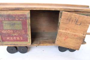 lot 161 image: Large antique livestock advertising box car, made of wood, missing one wheel, marked 1910, great patina, 14.25 long 5 wide