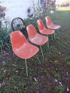 lot 188 image: 4 mid century modern Herman Miller orange fiber glass shell chairs, some edge damage and fading