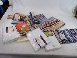 lot 103 image: Lot of Unused Rugs and Bedding still with price tags