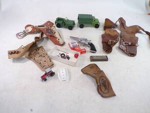 lot 139 image: Vintage Lot of toy Wells Fargo Gun Holster Toy Cap Guns with Caps and More