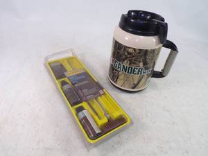 lot 250 image: Gun Cleaning Kit and Gander Mtn. Mug