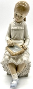 lot 164 image: NAO by LLADRO Girl With Chalkboard Collectible Porcelain Figurine # 117
