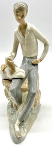 lot 167 image: NAO by LLADRO Jewish Boy with Spaniel Dog Collectible Porcelain Figurine