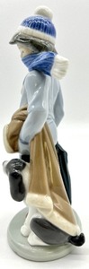 lot 172 image: LLADRO Winter Boy With Dog Porcelain Figurine #05220