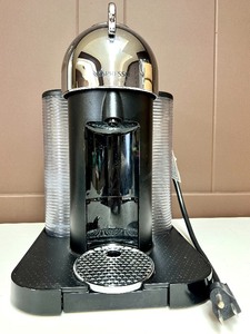 lot 106 image: NESPRESSO VERTUO LINE MACHINE with Pod Holder and boxes of Coffee Pods