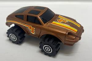 lot 7 image: 1980s Schaper Stomper 4X4  Cooper Gold Datsun 280Z (Works Great) (VERY CLEAN)