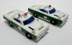 lot 73 image: Two 1960s Ideal Toys Motorrific Plymouth GTX Police Car Green And White (No Motor) Like New (Engines Where Sold Separately) 1 Missing Rear Drivers Side Tire