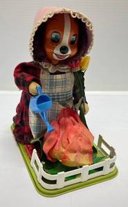 lot 97 image: Vintage Cragstan Battery Operated Lady Pup Tending Her Garden 7 34
