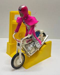 lot 105 image: 1975 Ideal Derry Darling Pink Trick Cycle Doll, Motorcycle & Launcher