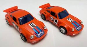 lot 124 image: Vintage 1960s Plastic Battery Operated Porsche Carrera Turbo Controller Cords Cut & 1 Missing Battery Door But Still Really Cool