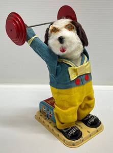 lot 138 image: 1950s-60s Cragstan Powerarm Barbells Battery Operated Toy Dog (WORKS)