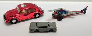 lot 208 image: Misc. 1950s60s Friction Toys Including RARE Chrome Red VW Bug