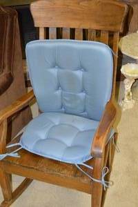 lot 30 image: Wooden Rocking Chair with Blue Plush Cushions