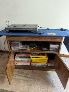 lot 84 image: Contents of TV Stand - DOES NOT INCLUDE TV STAND