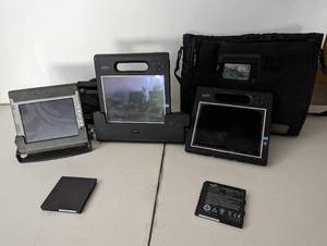 lot 86 image: Three Motion tablets and bags