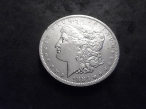 lot 11 image: 1884 O Morgan Silver Dollar