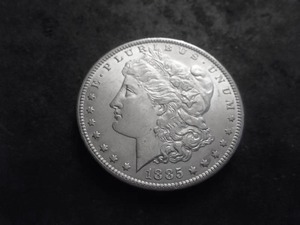 lot 12 image: 1885 O Morgan Silver Dollar