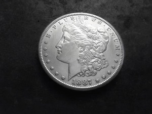 lot 15 image: 1887 S Morgan Silver Dollar