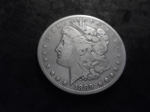lot 18 image: 1889 CC Morgan Silver Dollar