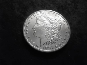lot 21 image: 1891 CC Morgan Silver Dollar