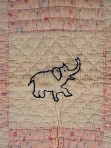 lot 106 image: Warm Vintage Handmade Quilt - Indigo Animals in Pink Floral Grid