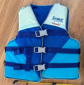 Two Childrens Life Jackets and Four Fishing Poles