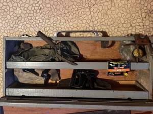 lot 19 image: Wooden tool box with saws, stapler, and misc tools.