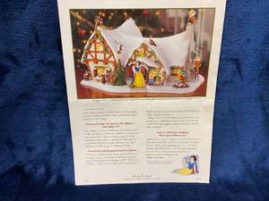 lot 91 image: Lighted Disney Snow White and Seven Dwarfs Christmas Cottage