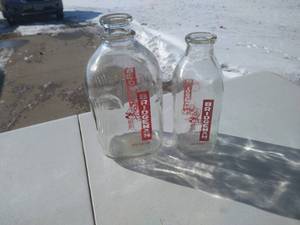lot 38 image: (2) Vintage Bridgeman Milk Bottles - Quart And Half Gallon