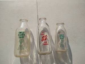 lot 63 image: (3) Vintage Milk Bottles