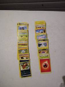 lot 136 image: (100) Pokemon Cards