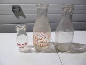 lot 189 image: (3) Vintage Milk Bottles