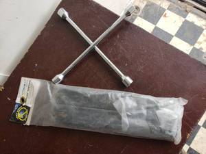lot 64 image: Tarp Cords and 4 Way Tire Iron