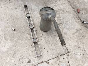 lot 77 image: Level and Oil Can