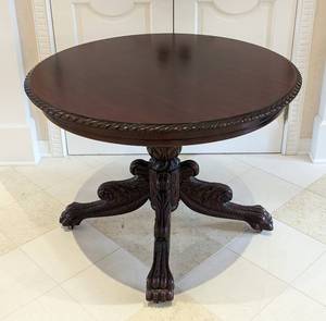lot 16 image: Round Carved Mahogany Clawfoot Foyer Table