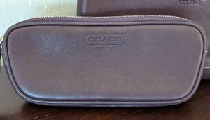 lot 39 image: Pair of Purple Coach Leather Cosmetic Bags