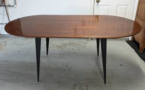 lot 84 image: Transitional Wood and Metal Pencil Leg Dining Table