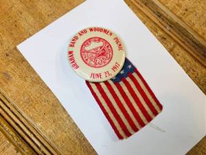 lot 40 image: 1917 Braham Band and Woodmen Price Pinback Button