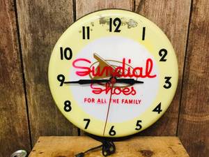 lot 114 image: Vintage Sundial Shoes Light-Up Store Wall Clock - Works