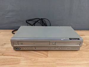 lot 120 image: Pre-Owned Trutech Funai Combo DVDVHS Player with Cables K