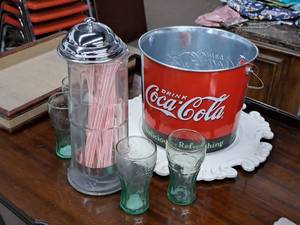 lot 1021 image: Collectibles - Coca-Cola Metal Ice Bucket with Serving Platter, (4) Coca-Cola Glasses and a Vintage Style Chrome Top Glass Straw Holder with Straws