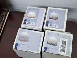 lot 1061 image: Lot of (4) Liadro Bells (in original packaging) - Winter, Spring, Summer, Fall