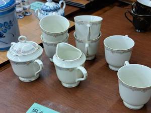 lot 1079 image: Sango Monroe Regency Collection Fine Ivory China Tea Set - 5 Creamer, 5 Sugar Bowl, (6) 3-12 Tea Cups