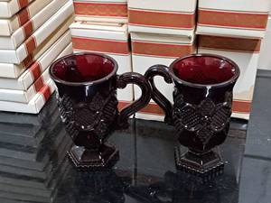 lot 1185 image: Lot of (6 Boxes) Avon 5 1876 Cape Cod Collection Red Glass Pedestal Mugs 2-count