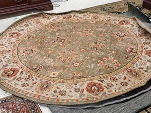 lot 1610 image: Oval Area Rug and Pad 92