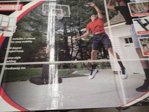 PORTABLE BASKETBALL HOOP. Adjusts from 7.5 to 10 ft
