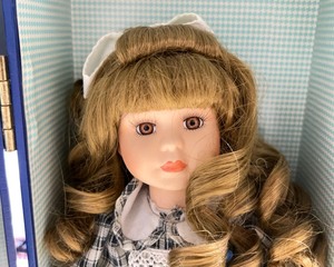 lot 1063 image: Lasting Impressions Porcelain Doll in Carrying Wardrobe Case