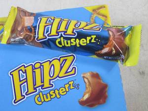 lot 204 image: (C-2) Box of 24 Flipz Clusterz Candy Bars Past Date