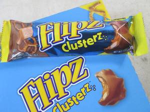 lot 205 image: (C-2) Box of 24 Flipz Clusterz Candy Bars Past Date