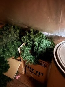 Four Large Boxes of Christmas Garland and a Box of Large Red Bows